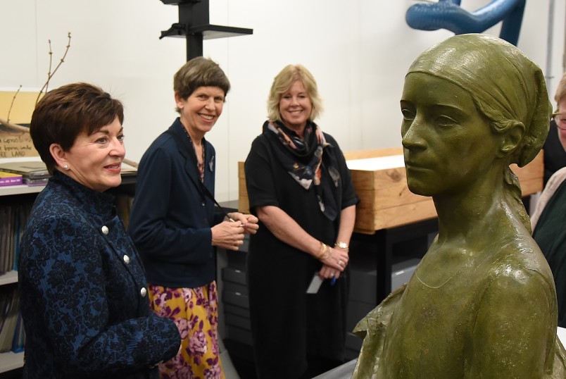 Image of Dame Patsy viewing a statue
