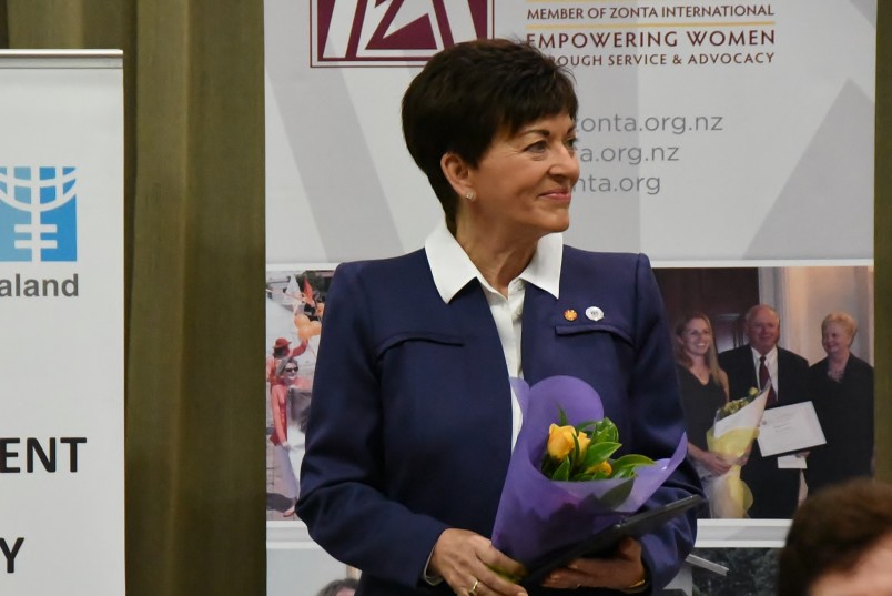 an image of Dame Patsy presented with Zonta's yellow roses