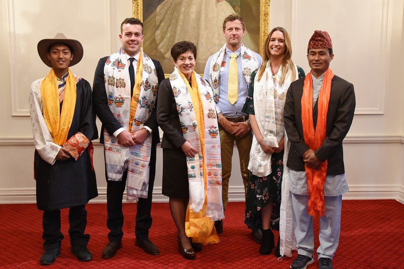 Image of Dame Patsy with recipients and guests after the presentation of Nepalese scarves