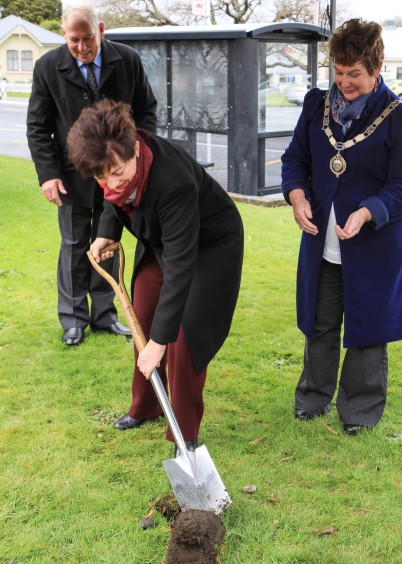 an image of Dame Patsy turning a sod for the Paul Dibble sculpture