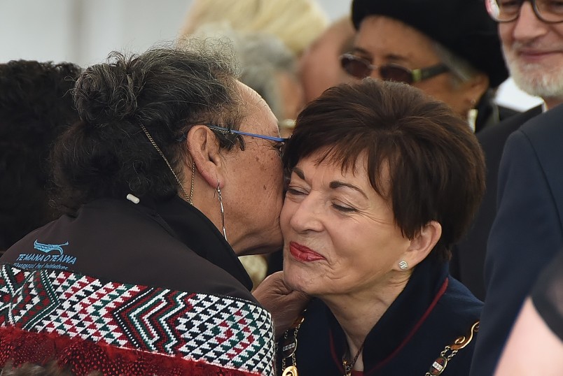 Image of dame Patsy being kissed by a kuia on Putiki Marae