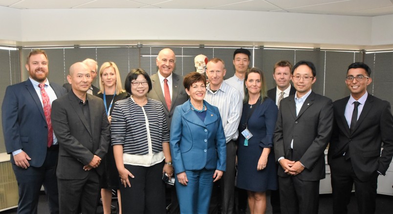 IMage of Dame Patsy and Sir David with academic and research staff at the Auckland Bioengineering Institute