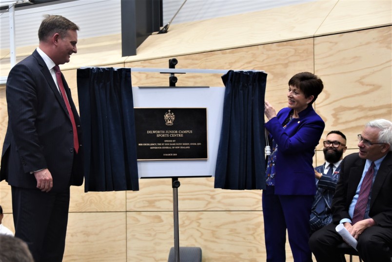 Dame Patsy and Aaron Snodgrass unveil a plaque in DIlworth's new sports centre