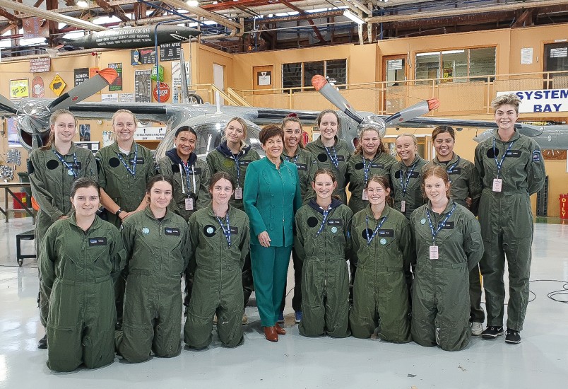 Image of Dame Patsy with students in the Logistics Training Squadron hangar