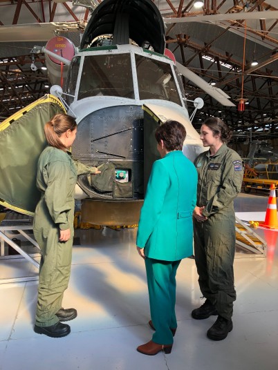 Image of Dame Patsy looking at a plane