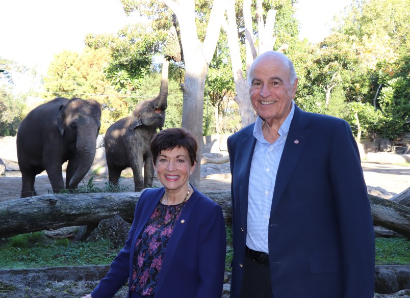 Image of Dame Patsy and Sir David with the elephants at Auckland Zoo