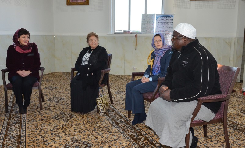 The imam of the Linwood Islamic Centre speaking to Dame Patsy