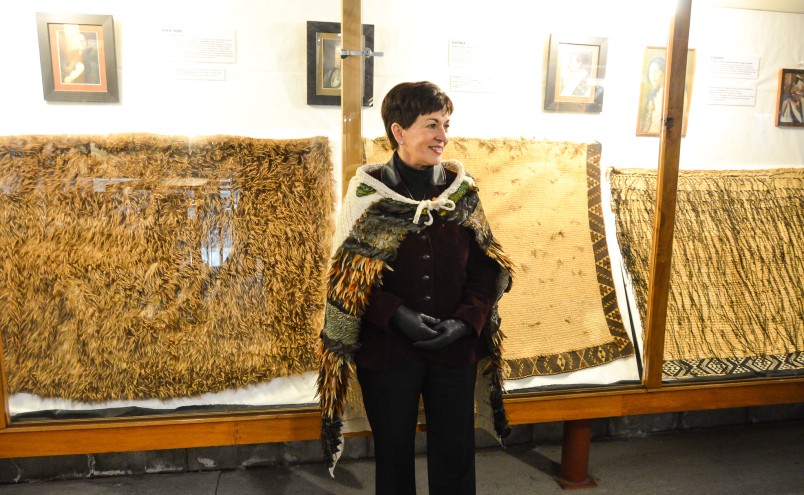 Dame Patsy with some of Okains Bay Museum's beautiful korowai