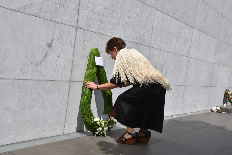 Dame Patsy lays a wreath