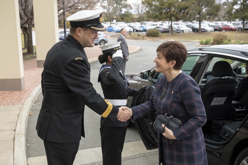 Image of Dame Patsy being greeted at the Australian Defence College by Acting Commander  Commodore Peter Leavy 