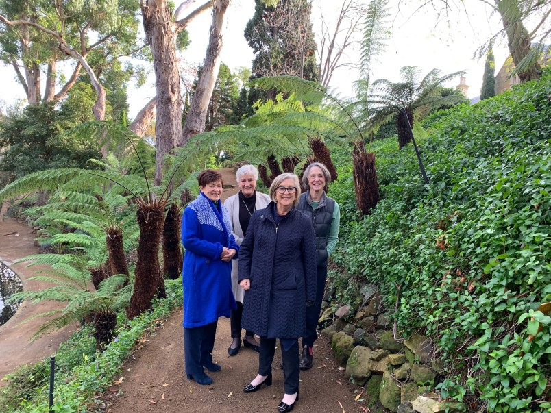 dame Patsy and others in the garden at Government House in Hobart