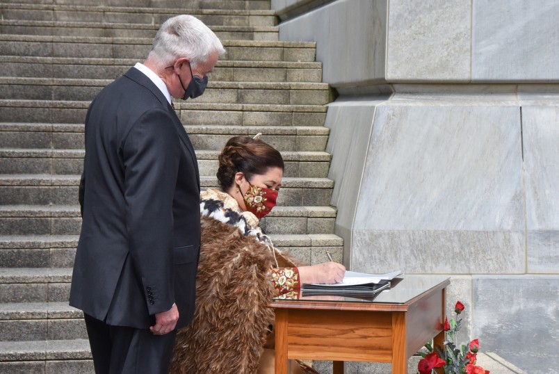 Dame Cindy Kiro signing the visitor's book