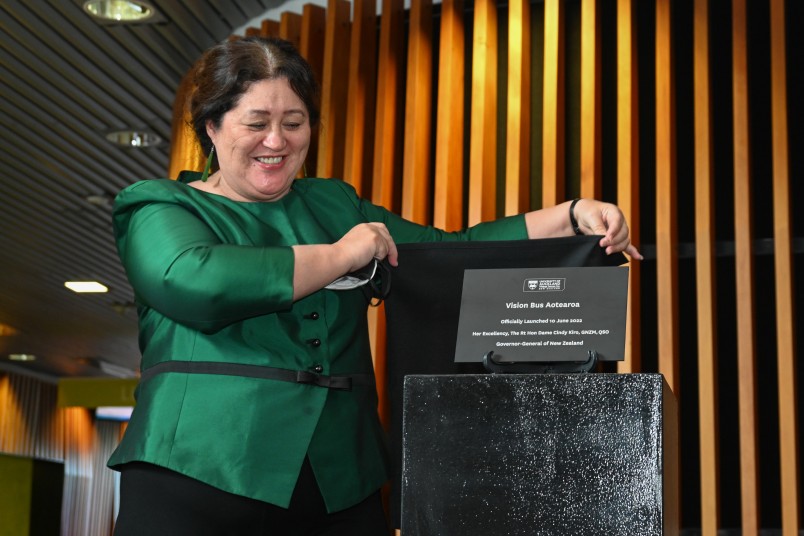 Dame Cindy Kiro unveils the plaque signalling the official opening of Vision Bus Aotearoa