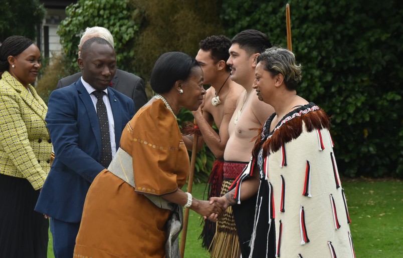 HE Mrs Dorothy Hyuha greeting a member of the Cultural Party