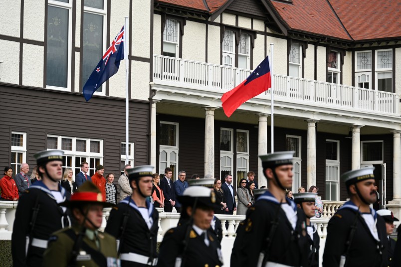 The flags of New Zealand and Samoa fly on the Government House Lawn