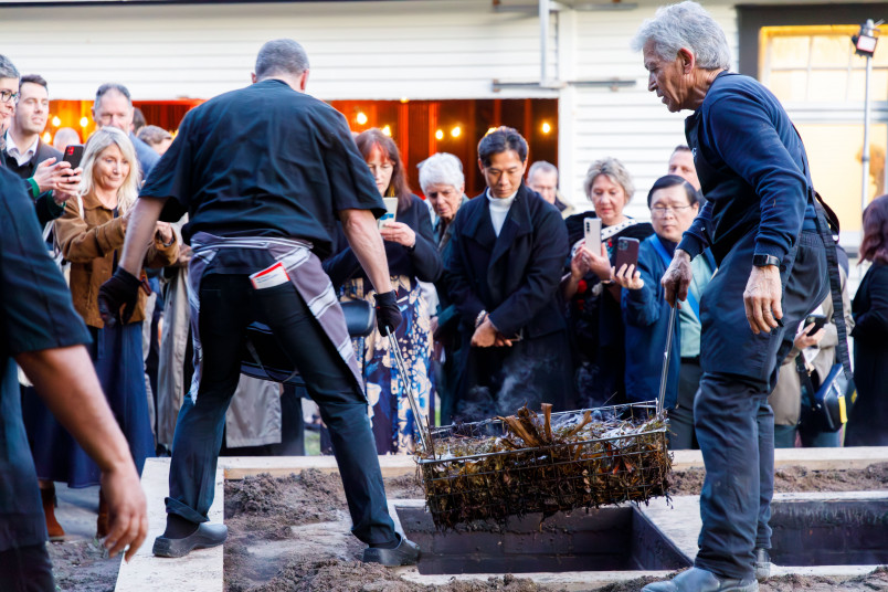 The cooked hāngī emerges