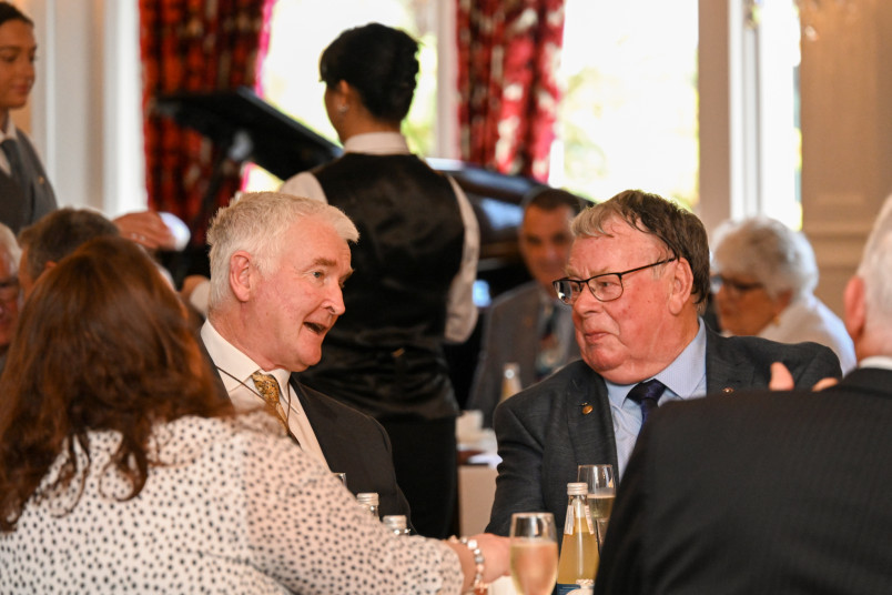 Dr Davies speaks to David Drake at the high tea