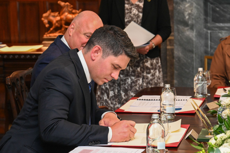 Mr Meager signing his affirmation documents