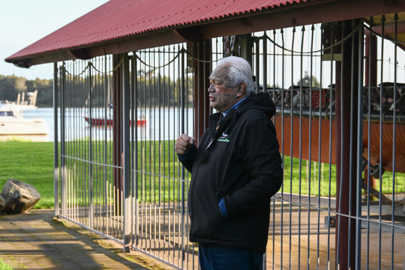 Joe Harawira stands by a replica of the waka Mātaatua