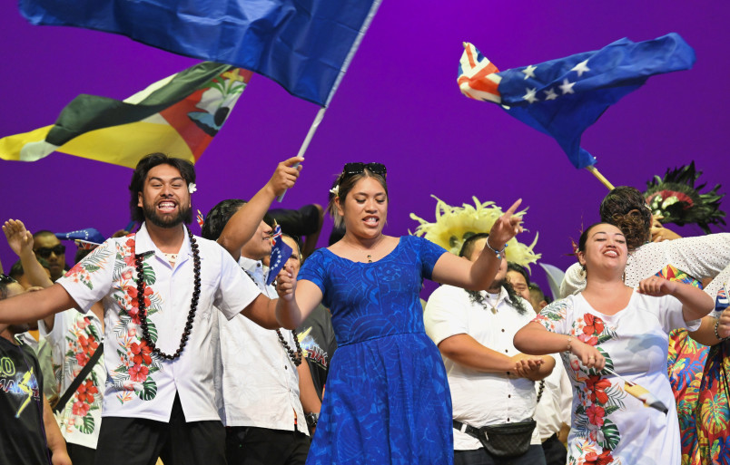 Performance with Cook Islands flags flying