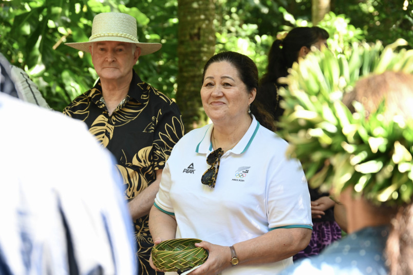 Dame Cindy with a woven basket gift