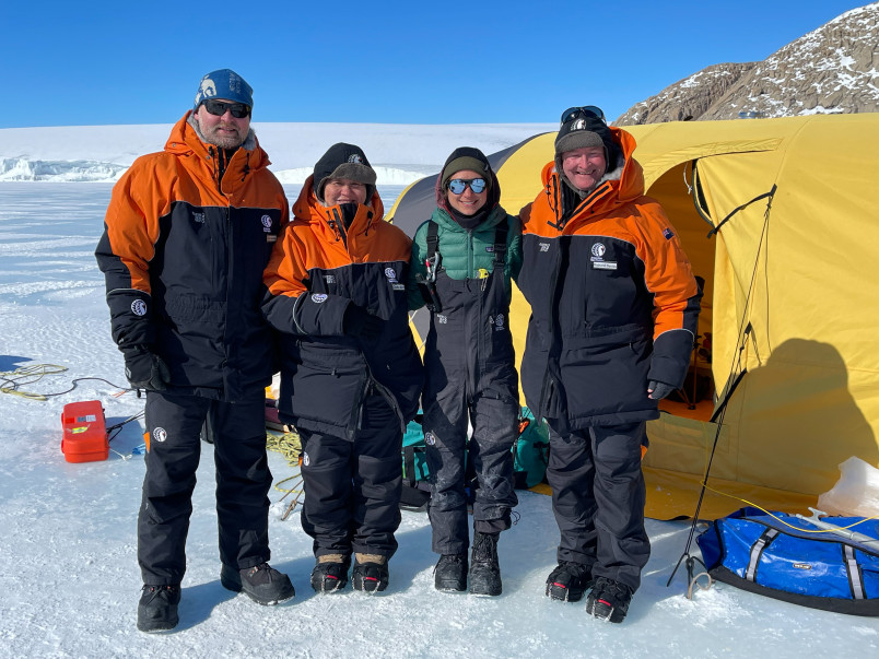 Dr Jordy Hendrikx, Dame Cindy, Dr Sarah Seabrook, and Dr Davies on the ice in front of technical tent.