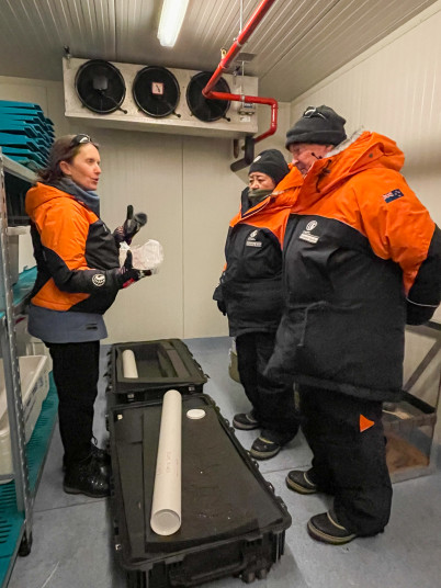 Dr Inga Smith, of Otago University, explaining her work to Dame Cindy and Dr Davies with ice core on display.