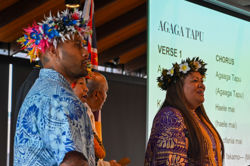 Attendees sing a hymn