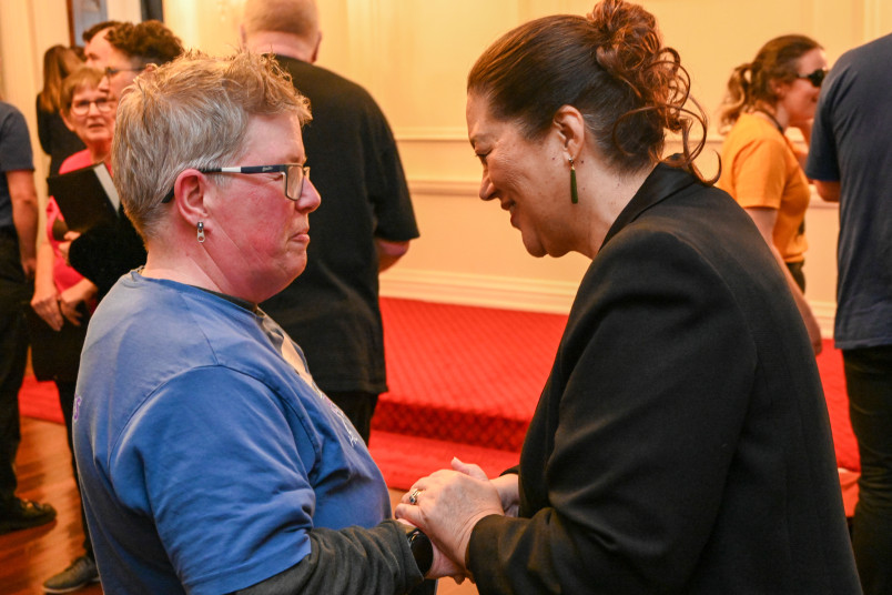 Dame Cindy meeting an attendee