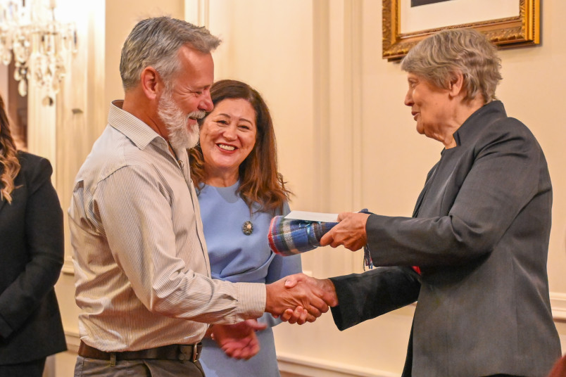Dame Cindy and Helen Clark present Dr Gordon Macdonald with a gift