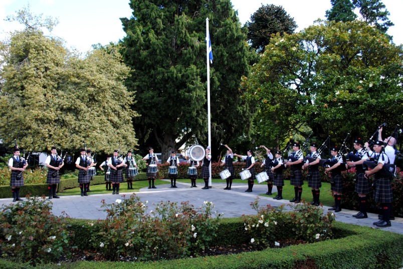 The St Andrew's College Pipe Band performs.