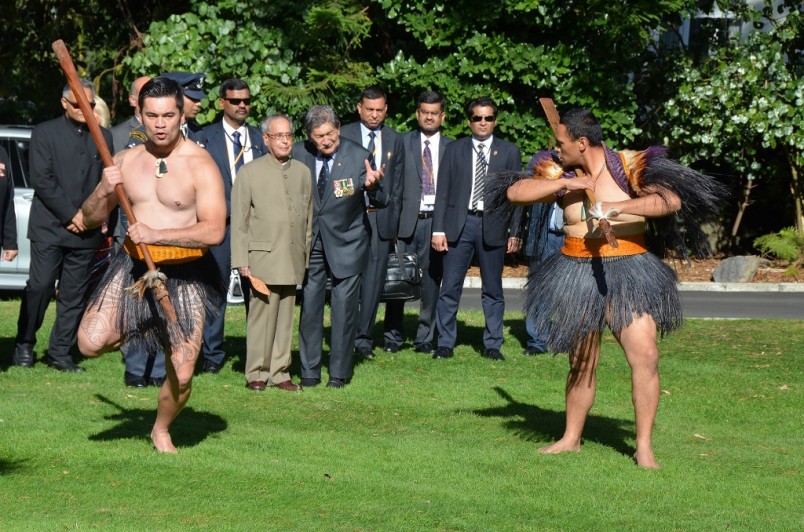 President Mukherjee is escorted by members of the Cultural Party.