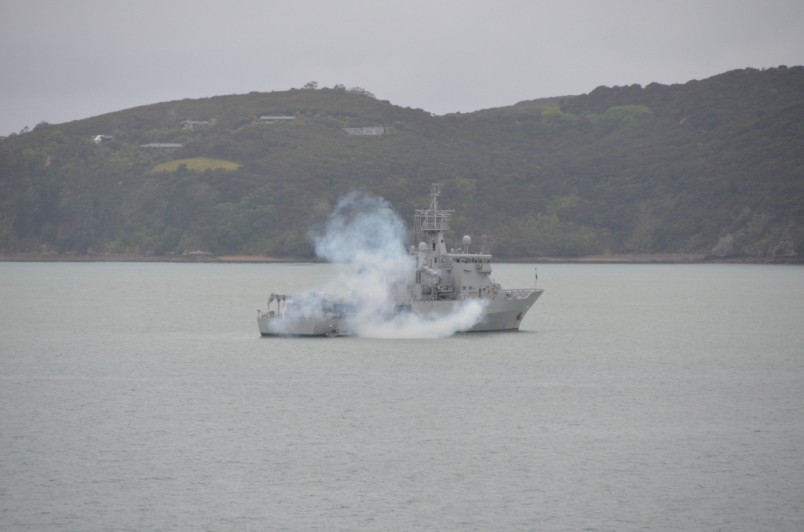 HMNZS Wellington fires a saluting gun.