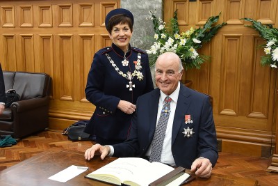 Dame Patsy Reddy and Sir David Gascoigne sign the Visitors' Book at Parliament.