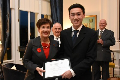 An image of Dame Patsy with Sean Chan, winner of the essay-writing competition