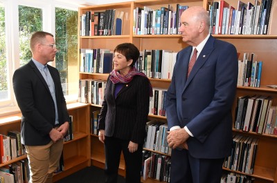 Image of Dame Patsy and Sir David being shown around the offices of the New Zealand AIDS Foundation