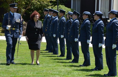 Image of the High Commissioner of Cyprus, HE Mrs Martha Mavrommati inspects the Guard of Honour