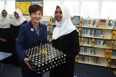 Image of Dame Patsy presenting Romana Ali the prize for winning an Elite Award in the Education Perfect English Competition  