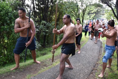 an image of Warriors leading the official party to Maiki Flagstaff