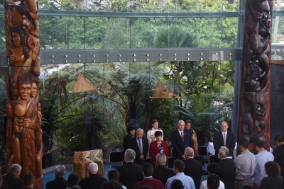 an image of Dame Patsy and Sir David at Te Ahu, flanked by po representing Muriwhenua iwi