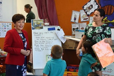 an image of Dame Patsy with new entrant children at Kaitaia Primary School
