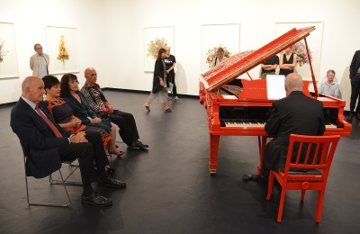 Image of Micahael Houston playing the Michael Parekowhai piano sculpture