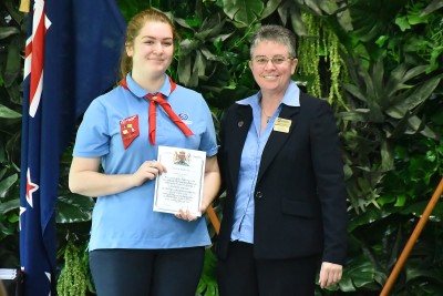 Image of GirlGuiding NZ National President Fiona Harnett presenting Jessica Andersen with her award