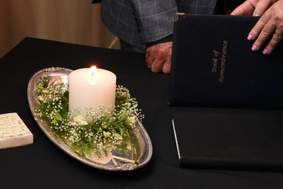 an image of Memorial candle and memorial book