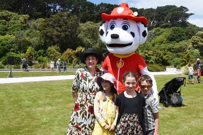 Image of Dame Patsy and co cuddling up with Marshall from 'Paw Patrol'