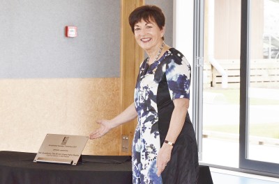 Image of Dame Patsy with the plaque