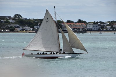 an image of a Yacht sailing past Devonport