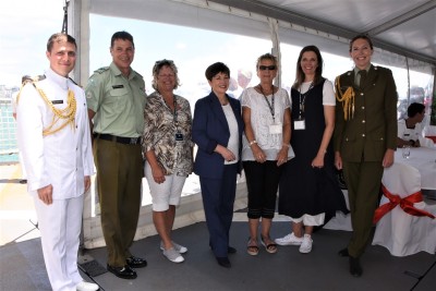an image of Dame Patsy with service personnel and guests from Devonport Hospice 