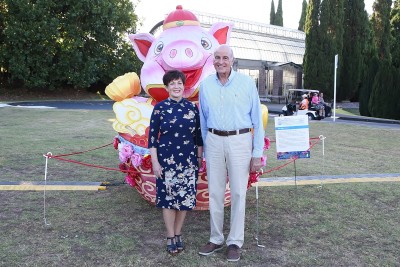 Image of Dame Patsy and Sir David with a pig shaped lantern
