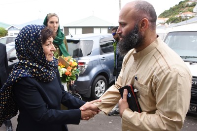 Image of Dame Patsy being greeted by Tahir Nawaz, President of the International Muslim Association of New Zealand 